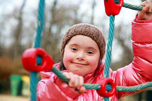 Inclusive Communities Girl toddler on bike