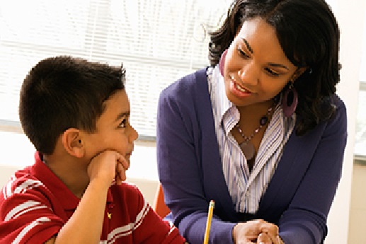 Black woman teacher with young student