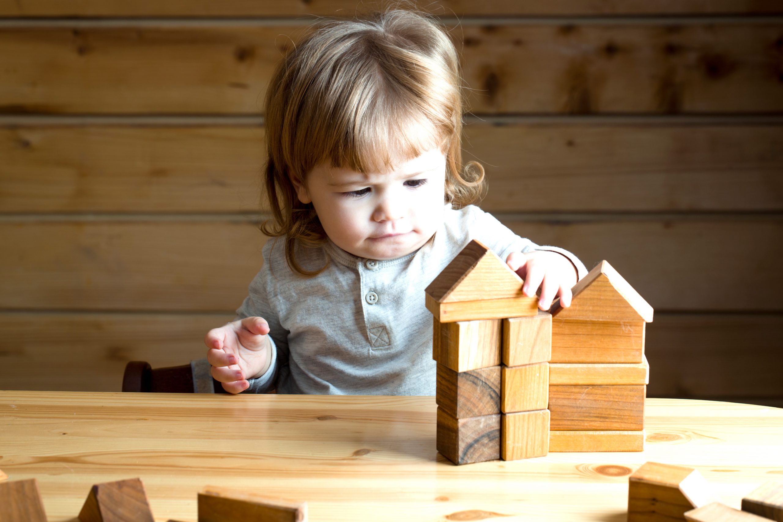 Boy with wooden cubes