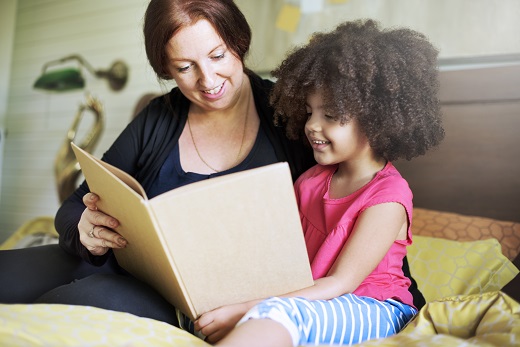 Literacy Center Girl reading with teacher