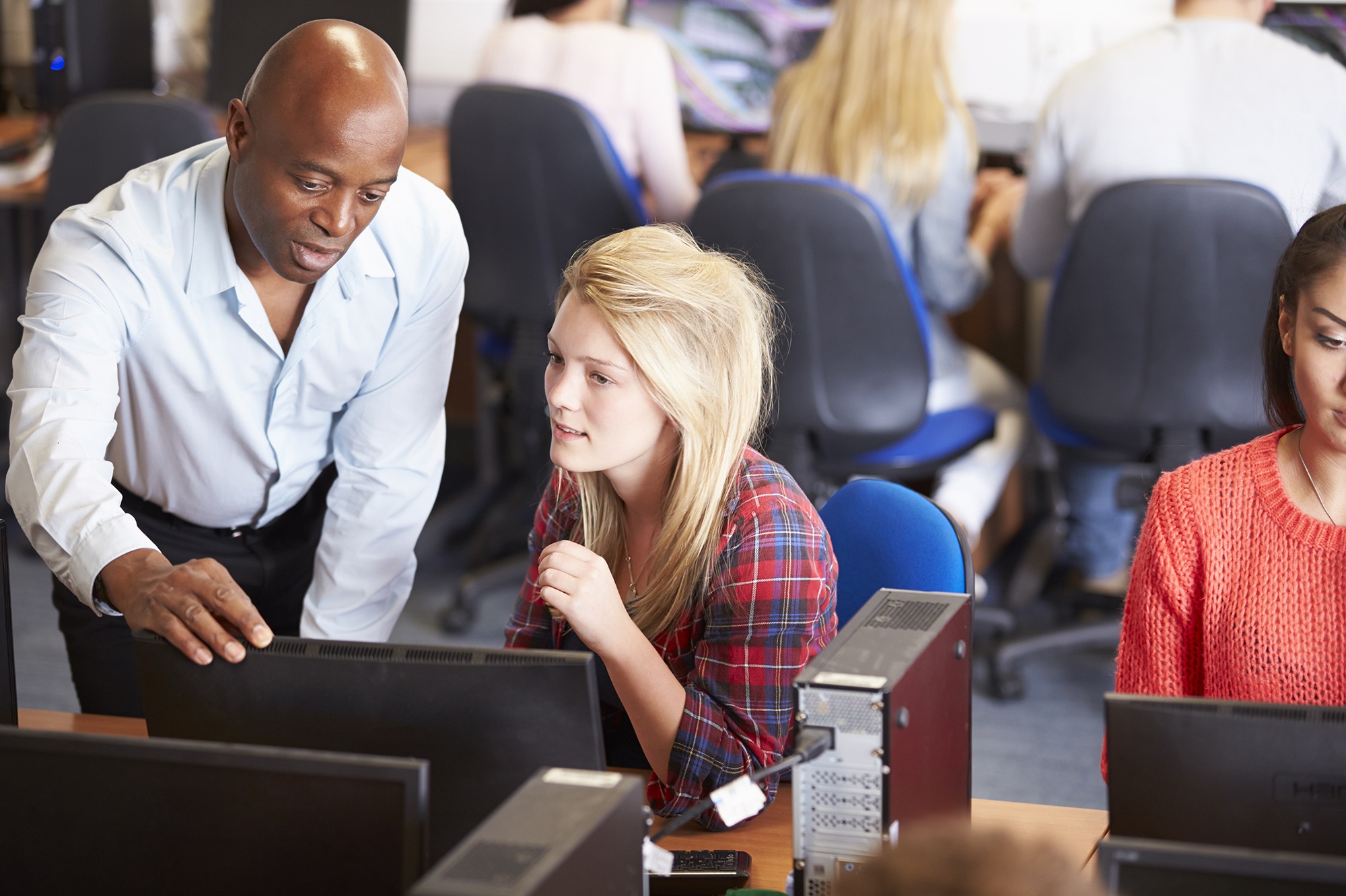 College Students At Computers In Technology Class