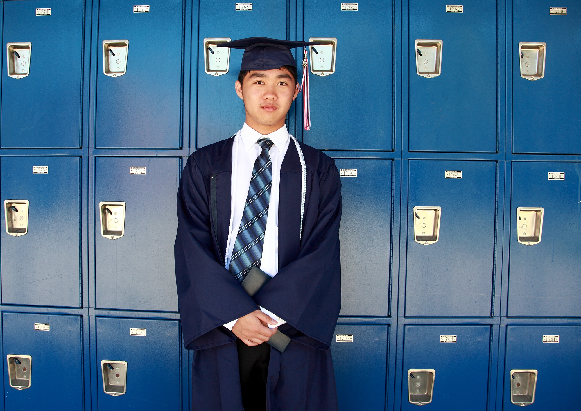 Young asian boy on his graduation day.