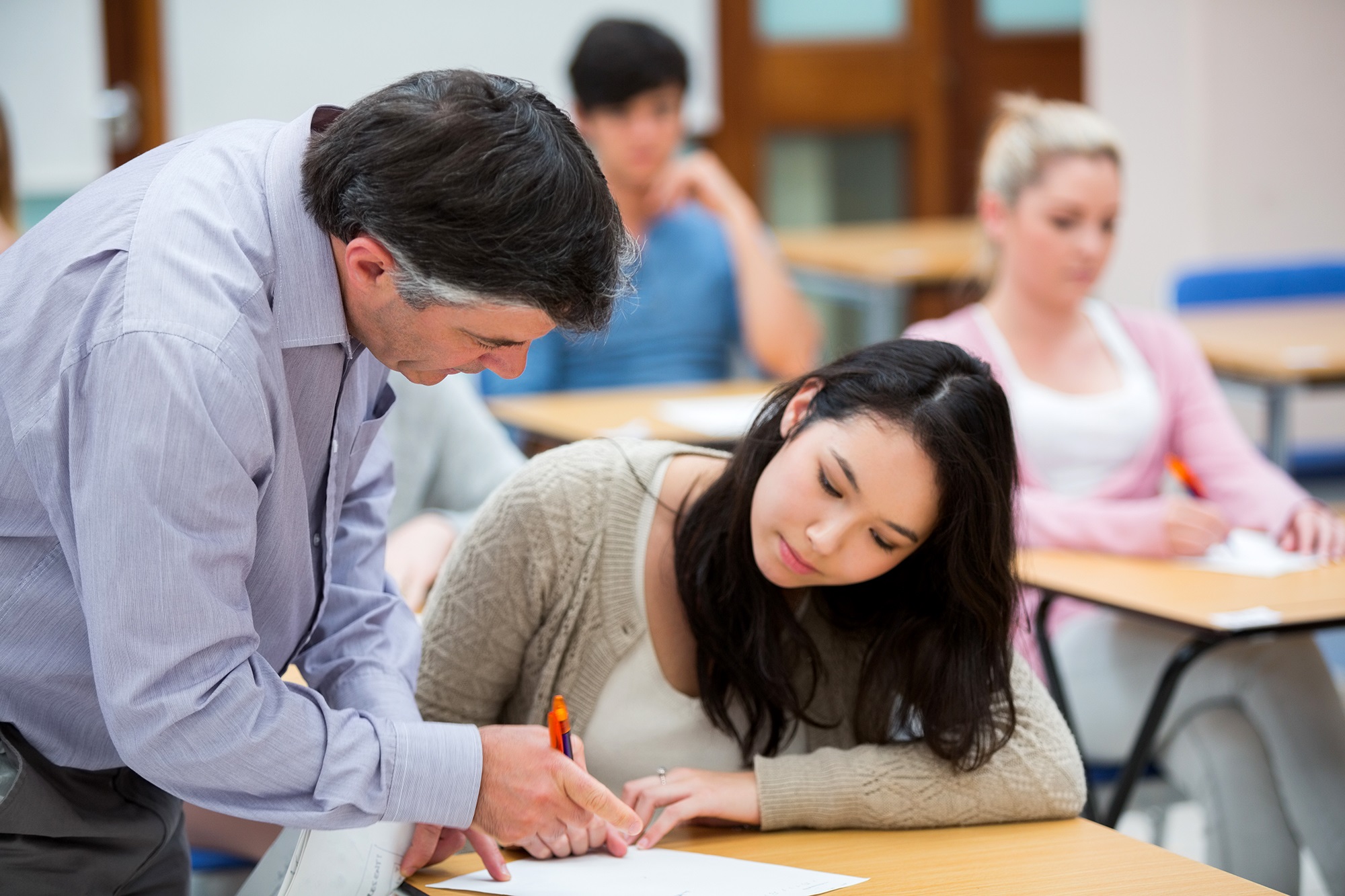 Teacher explaining in classroom